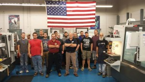 Caption: Machining instructors Dwight Barnes and Dexter Edwards are pictured with first and second year machining students.