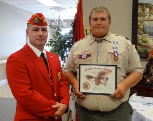 Dakota Thompson (far right) was awarded the rank of Eagle Scout on Sunday. He also received the Good Citizenship Award from Lewis Rice III (left), Eagle Scout Coordinator for the Johnston County Marine Corps League Carry-On Detachment.   