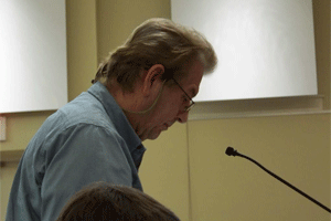 Jim Dempster speaks before Clayton Town Commissioners Tuesday night in opposition of a major development on NC42 at Glen Laurel Road near his home.  WTSB Photo