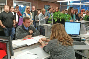 Ronald Johnson (seated facing camera) is assisted by Johnston County Board of Elections Director Leigh Anne Price as Johnson files for the Johnston County Board of Education. Johnson was joined by 60 supporters when he filed.   WTSB Photo
