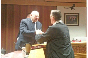 Commissioner Chairman Tony Braswell shakes hands with a concerned resident following Wednesday nights meeting to discuss the proposed CSX terminal. WTSB Photo