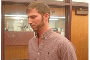 Trent Lassiter, who launched a social media campaign to stop CSX from taking his family property, prepares to speak with a TV reporter following the meeting. WTSB Photo