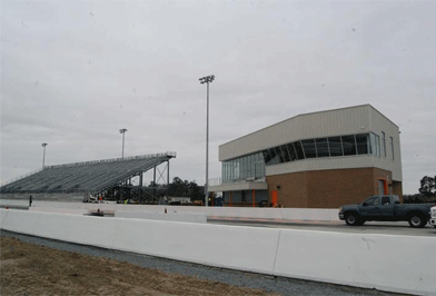 The grandstands that flank either side of the centerpiece at GALOT Motorsports Park in Benson — a certified smooth-as-silk eighth-mile stretch of asphalt — are from Daytona International Speedway in Florida, acquired when the facility was undergoing some upgrades. Also pictured, the facility’s new tower complete with executive suites, high-tech control room and media room. The Daily Record Photo