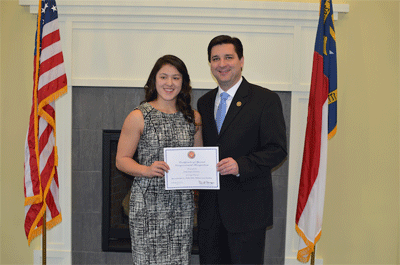 Congressman David Rouzer and Dominique Quintero of Clayton at the U.S. Naval Academy Nomination Reception in Wilmington. 
