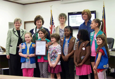 Members and leaders of Girl Scout Troop #963 pose with Mayor Cheryl Oliver (left) after being recognized during the March 8th town council meeting. JoCoReport.com Photo