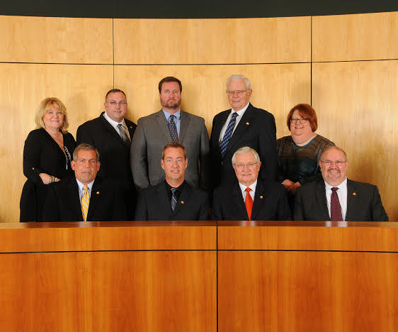 From left, back row: Town Clerk Kimberly Moffett; Councilman Jason Thompson; Town Manager Steve Biggs; Councilman Art Holder; Deputy Town Manager Nancy Medlin. Front Row: Councilman Bob Satterfield; Mayor Jody McLeod; Mayor Pro Tem Michael Grannis; Councilman Butch Lawter.
