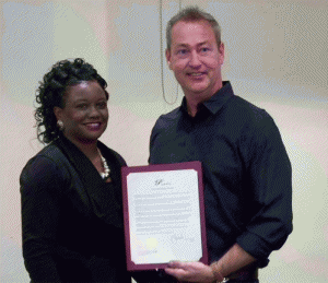 (Left to right) Angela Williams with Interstate Ministries accepts a proclamation from Clayton Mayor Jody McLeod recognizing May 5th as a National Day of Prayer. JoCoReport.com Photo 