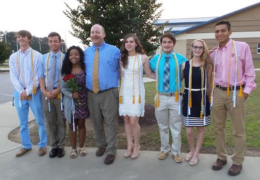 Students pose with their new Honors Cords after the awards Ceremony. From Left to Right, Landon Brown, Garrett Lee, Ashantee Pickett, NHS Advisor-John Wood, Sarah Renfrow, Harrison Allen, Jenna Burge and Jay Waltman.