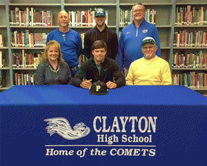 Clayton High School senior Blake Joyner (center) signs a letter of intent to play baseball at UNC Pembroke. Sitting with him are his mother Wendy Gordon (left) and grandfather Charles Petit (right). On the back row (from left) are Athletic Director and Baseball Coach Stacey Houser, Jeffrey Joyner (brother) and Principal Clint Eaves.