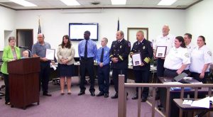  Selma Mayor Cheryl Oliver (left) recognizes officials from Sysco, the Selma Fire Department and Selma EMS whose combined efforts saved the life of Sysco employee and Archer Lodge fireman John Dusek on May 20th.  JoCoReport.com Photo 