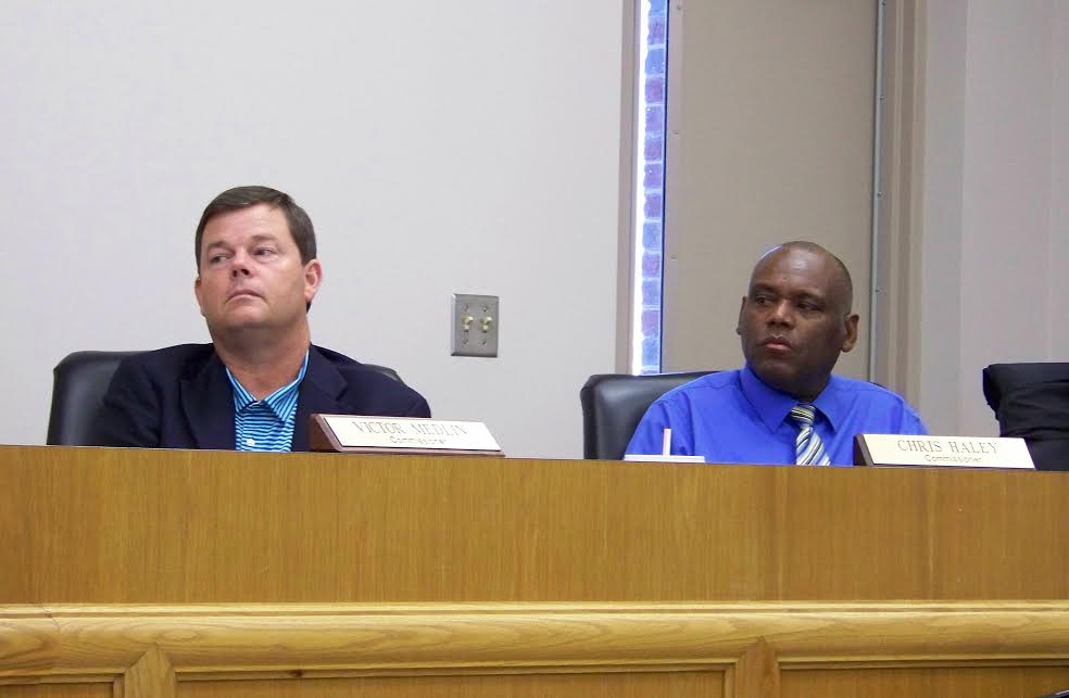 (Left to right) Four Oaks town commissioners Vic Medlin and Chris Haley listen to comments during a public hearing on the 2016-17 fiscal year budget Monday night. After the hearing, the board voted unanimously to raise the property tax rate from 38 to 42 cents. JoCoReport.com Photo