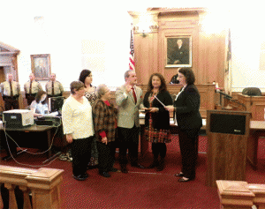 Former school board member and newly-elected county commissioner receives his Oath of Office from Clerk of Court Michelle Ball.  JoCoReport.com Photo