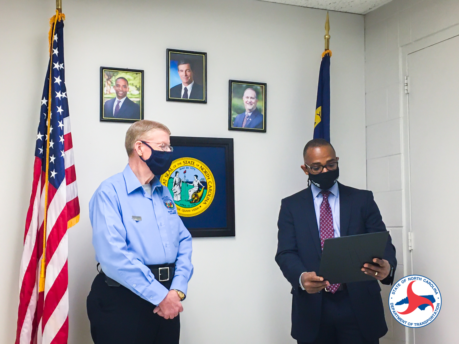DMV officials celebrating a 50-year employee