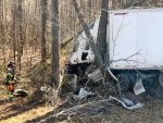Tractor Trailer Crashes Into Guardrail, Trees Along I-95