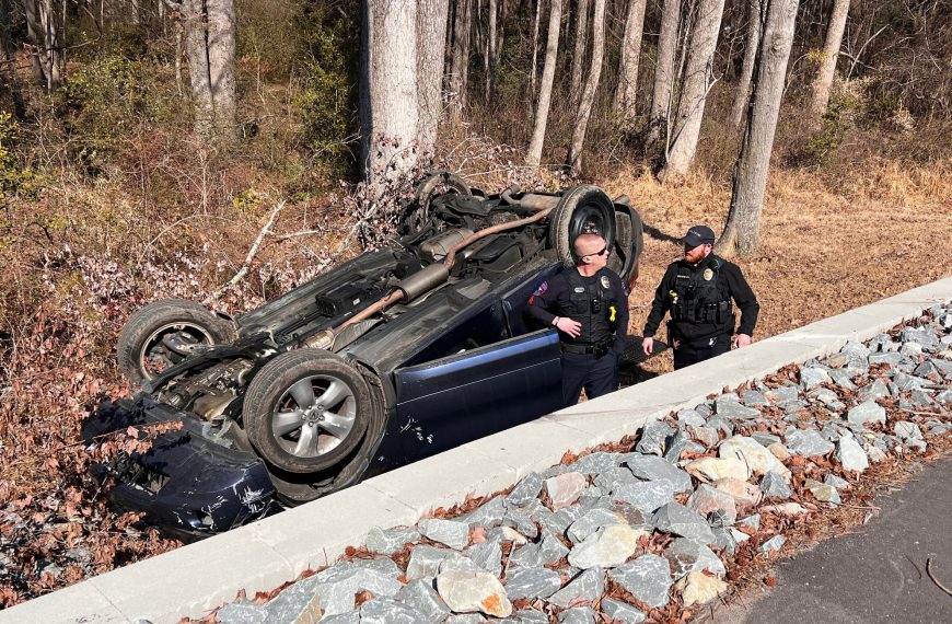 Vehicle Overturns After Going Over Retaining Wall